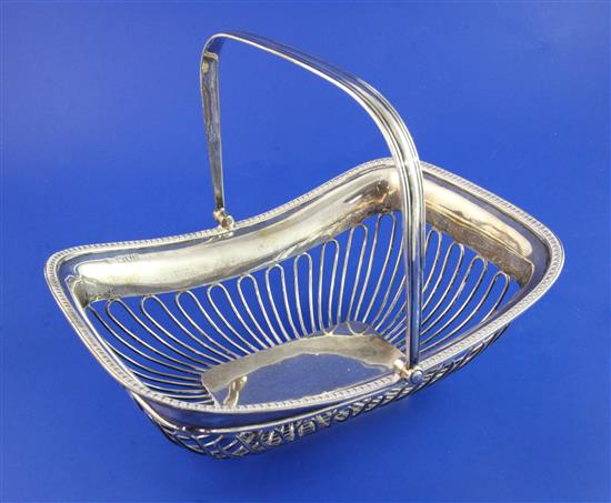 A George V silver wirework cake basket by Goldsmiths & Silversmiths Co Ltd, 20 oz.